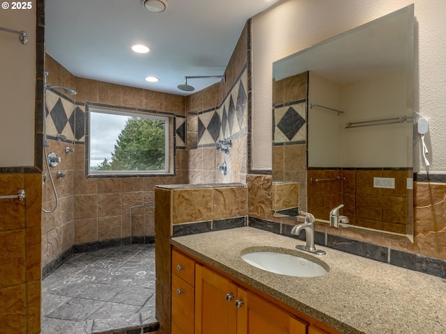 13200 NW Old Germantown Rd, Portland, OR 97035 - bathroom featuring tile walls, a tile shower, vanity, and recessed lighting