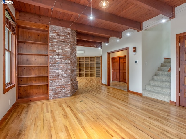 13200 NW Old Germantown Rd, Portland, OR 97035 - unfurnished living room with wood ceiling with exposed beams, wood finished floors, stairway, and baseboards