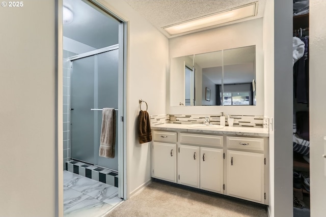 bathroom with vanity and an enclosed shower