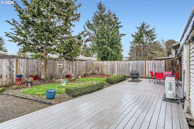 wooden terrace featuring a fire pit