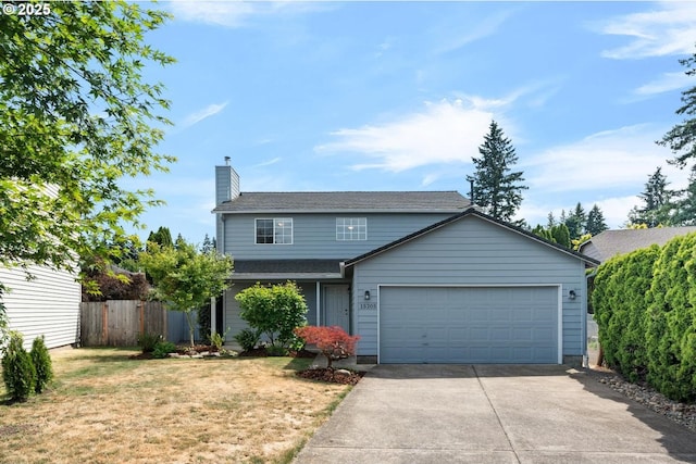 15205 NE 47th St, Vancouver, WA 98682 - traditional-style home featuring an attached garage, a chimney, and driveway