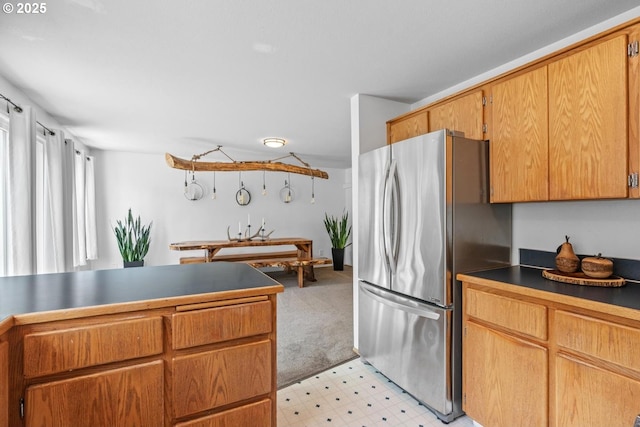 15205 NE 47th St, Vancouver, WA 98682 - kitchen with freestanding refrigerator, light flooring, and dark countertops