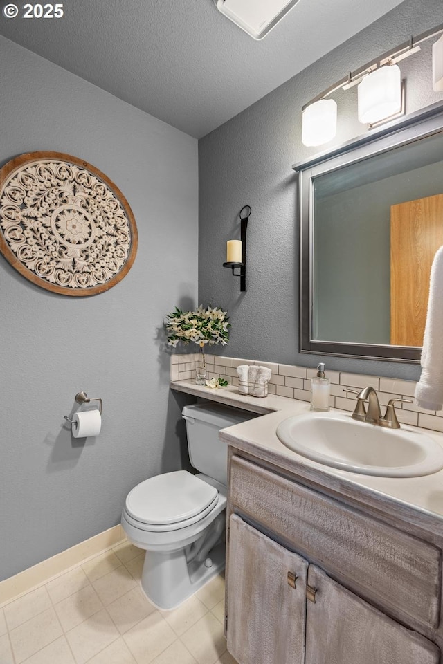 15205 NE 47th St, Vancouver, WA 98682 - bathroom with vanity, decorative backsplash, a textured ceiling, and tile patterned floors