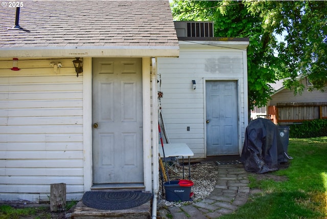 335 Marie St, Medford, OR 97504 - view of exterior entry with roof with shingles and fence