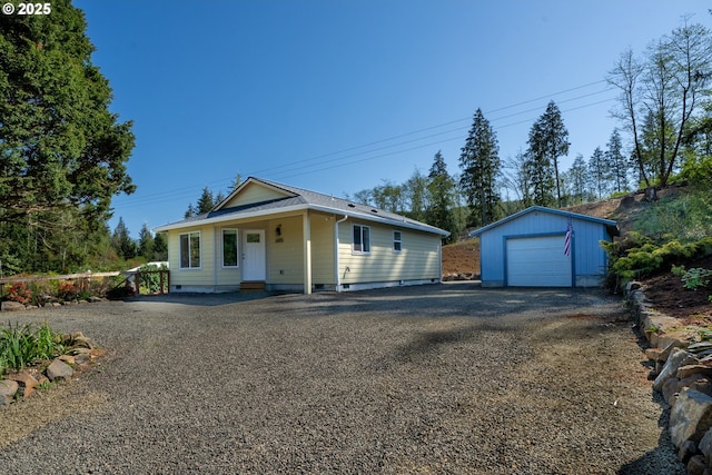bungalow with crawl space, driveway, an outdoor structure, and a garage