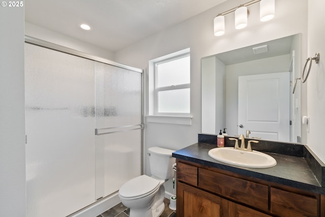 bathroom with toilet, recessed lighting, a shower stall, and vanity