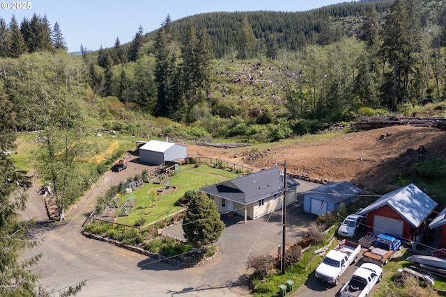 bird's eye view featuring a forest view