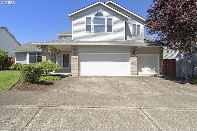 3317 SW Eastwood Ave, Gresham, OR 97080 - traditional-style house featuring a garage, concrete driveway, a shingled roof, and brick siding