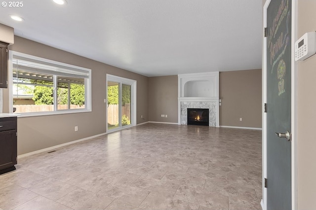 3317 SW Eastwood Ave, Gresham, OR 97080 - unfurnished living room with baseboards, a fireplace, and recessed lighting