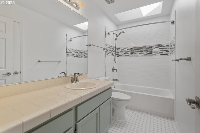 3317 SW Eastwood Ave, Gresham, OR 97080 - bathroom featuring a skylight, vanity, toilet, shower / washtub combination, and tile patterned floors