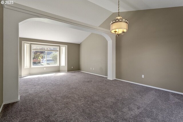 3317 SW Eastwood Ave, Gresham, OR 97080 - spare room featuring vaulted ceiling, carpet, arched walkways, and baseboards