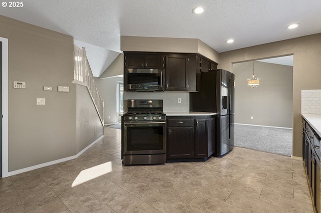 3317 SW Eastwood Ave, Gresham, OR 97080 - kitchen featuring range with gas stovetop, stainless steel microwave, baseboards, light countertops, and fridge with ice dispenser