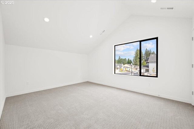 additional living space with lofted ceiling, carpet, and baseboards