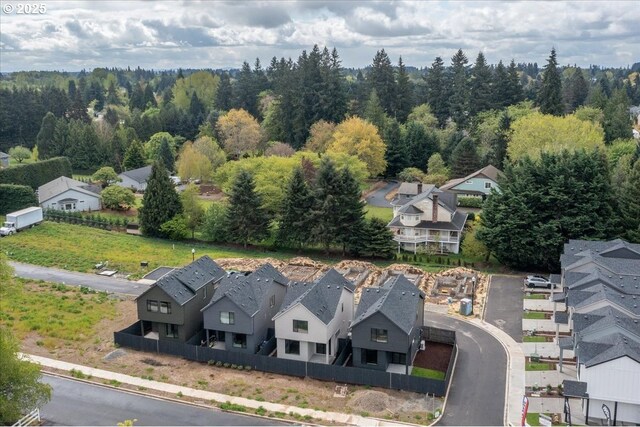aerial perspective of suburban area featuring a forest