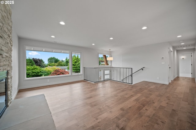 1908 50th St, Washougal, WA 98671 - unfurnished living room featuring wood finished floors, recessed lighting, and a fireplace