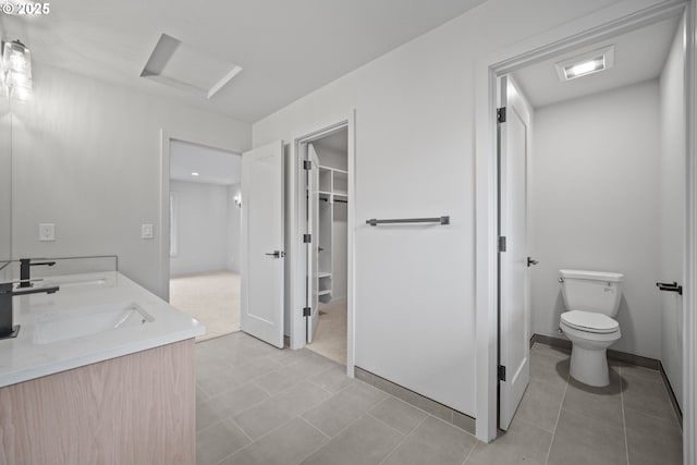 1908 50th St, Washougal, WA 98671 - bathroom with double vanity, a walk in closet, and tile patterned floors