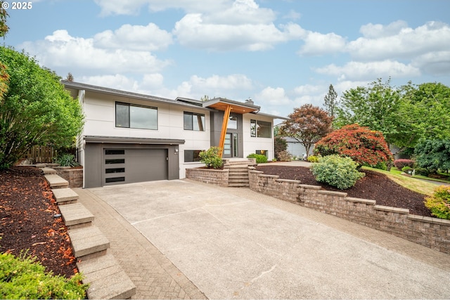 1908 50th St, Washougal, WA 98671 - contemporary home with a garage, driveway, and stucco siding