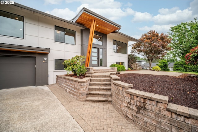 1908 50th St, Washougal, WA 98671 - view of front of home with stucco siding, driveway, and an attached garage