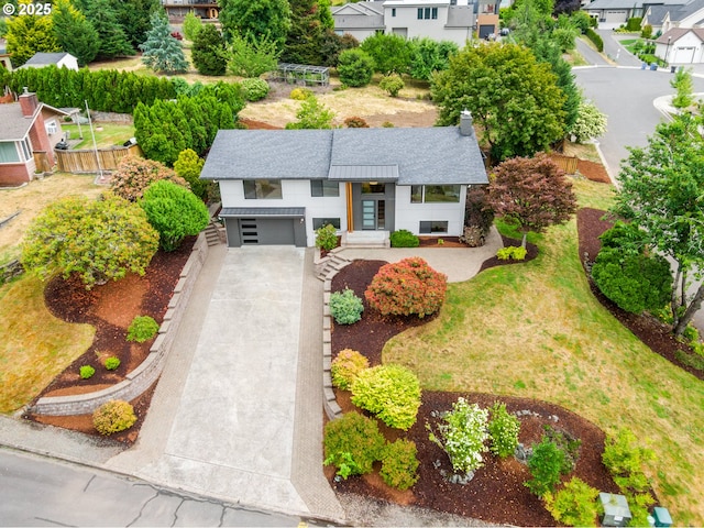 1908 50th St, Washougal, WA 98671 - view of front of home featuring roof with shingles, a residential view, concrete driveway, and a garage