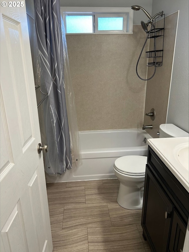 full bath featuring vanity, toilet, and shower / bath combo with shower curtain