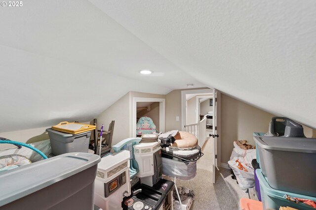 additional living space featuring carpet flooring, vaulted ceiling, and recessed lighting