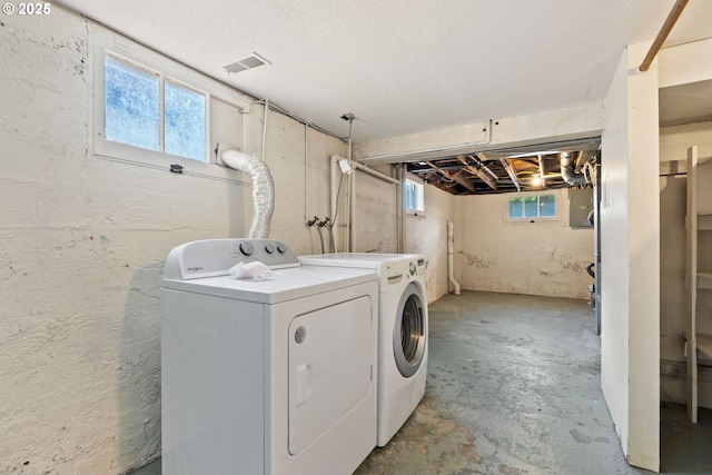 5655 SW Lombard Ave, Beaverton, OR 97005 - laundry area featuring washer and dryer and healthy amount of natural light