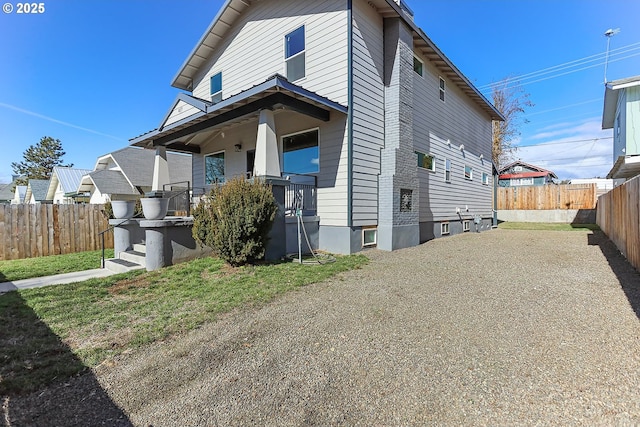 view of front facade with fence and a porch