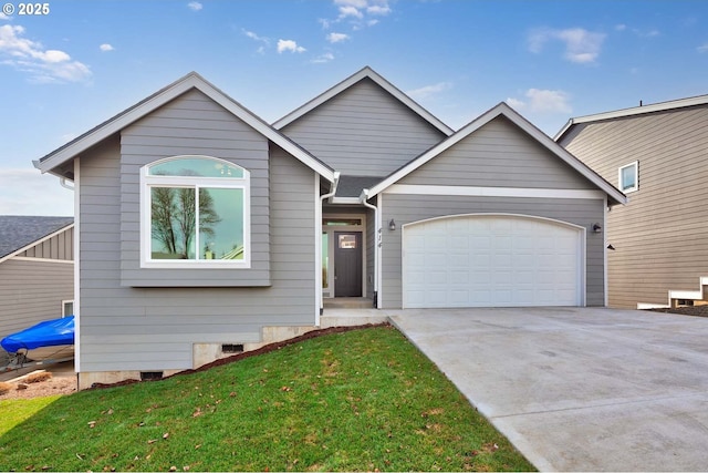 414 Hedin Ter, Gaston, OR 97119 - view of front facade with concrete driveway, a garage, and a front lawn