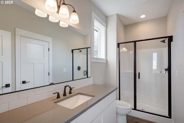 414 Hedin Ter, Gaston, OR 97119 - full bathroom with a shower stall, toilet, vanity, and backsplash