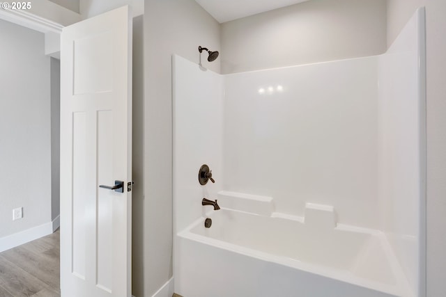 414 Hedin Ter, Gaston, OR 97119 - bathroom featuring tub / shower combination, wood finished floors, and baseboards
