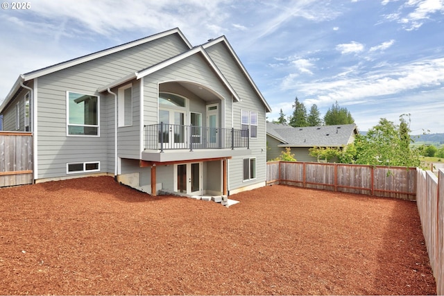 414 Hedin Ter, Gaston, OR 97119 - back of house featuring french doors, a fenced backyard, and a balcony