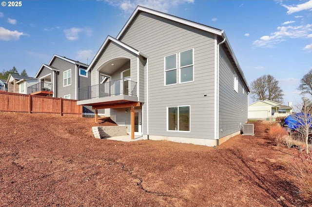 414 Hedin Ter, Gaston, OR 97119 - back of house featuring a balcony, central AC, a patio area, and fence