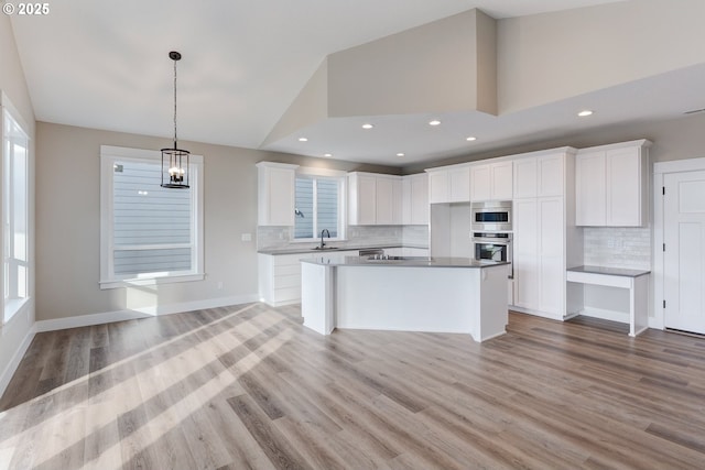 414 Hedin Ter, Gaston, OR 97119 - kitchen with appliances with stainless steel finishes, a sink, white cabinets, recessed lighting, and high vaulted ceiling