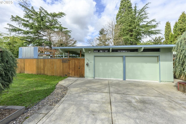 garage with concrete driveway
