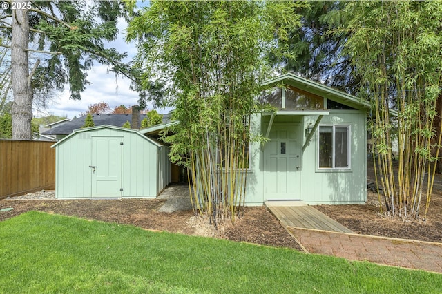 view of shed with fence