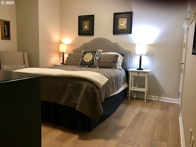 8867 SE 13th Ave, Portland, OR 97202 - bedroom with light wood finished floors