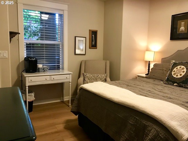 8867 SE 13th Ave, Portland, OR 97202 - bedroom with light wood-style flooring