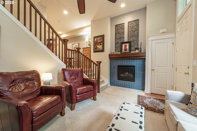 8867 SE 13th Ave, Portland, OR 97202 - carpeted living room with stairs, recessed lighting, a tile fireplace, and ceiling fan