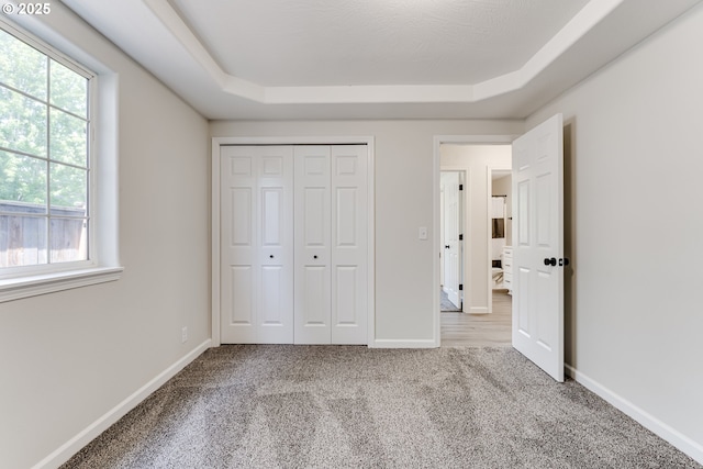 2977 Dry Creek Rd, Eugene, OR 97404 - unfurnished bedroom with carpet floors, a tray ceiling, and baseboards