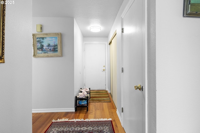 10137 SW Trapper Ter, Beaverton, OR 97008 - hall with wood finished floors and a textured ceiling