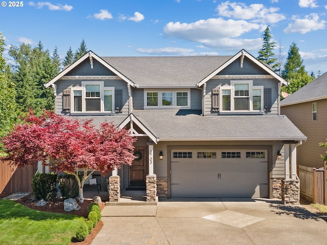 5703 SE 10th St, Gresham, OR 97080 - craftsman-style home featuring driveway, stone siding, a garage, and roof with shingles