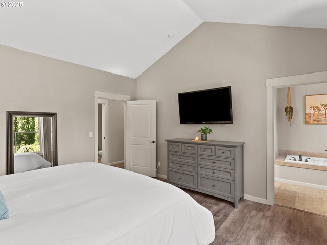 5703 SE 10th St, Gresham, OR 97080 - bedroom with high vaulted ceiling, wood finished floors, and connected bathroom