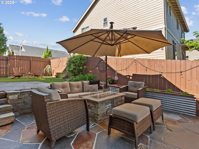5703 SE 10th St, Gresham, OR 97080 - fenced backyard featuring an outdoor living space with a fire pit and a patio area