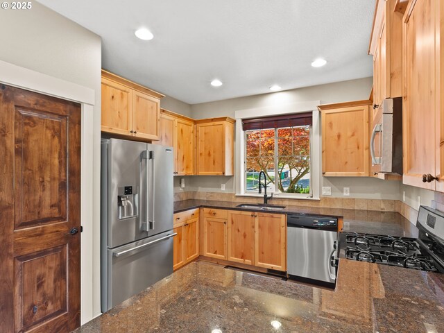 5703 SE 10th St, Gresham, OR 97080 - kitchen featuring stainless steel appliances, light brown cabinets, recessed lighting, and dark stone counters