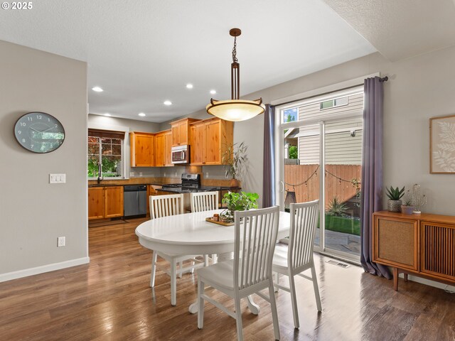 5703 SE 10th St, Gresham, OR 97080 - dining space with wood finished floors and recessed lighting