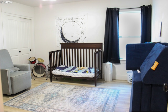 bedroom with a closet and wood finished floors