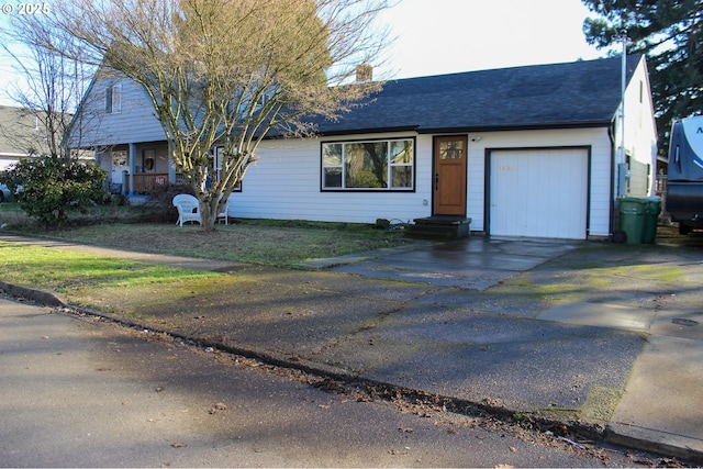 ranch-style house featuring aphalt driveway, a chimney, an attached garage, and a shingled roof