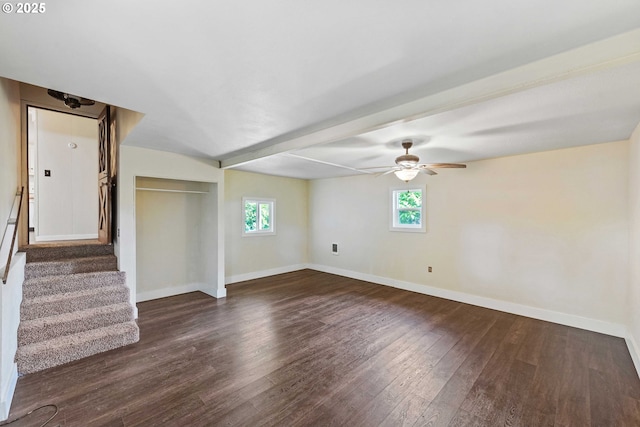 1565 California Ave, Coos Bay, OR 97420 - unfurnished room featuring dark wood finished floors, ceiling fan, stairs, and beam ceiling