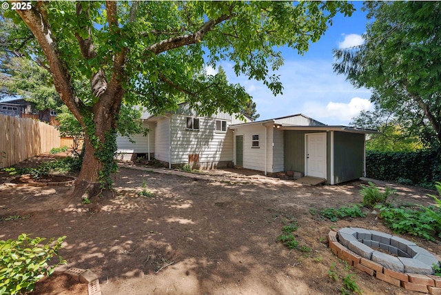 1565 California Ave, Coos Bay, OR 97420 - back of house featuring a fire pit and a storage unit