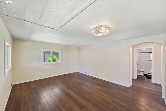 1565 California Ave, Coos Bay, OR 97420 - spare room with dark wood-style flooring and arched walkways